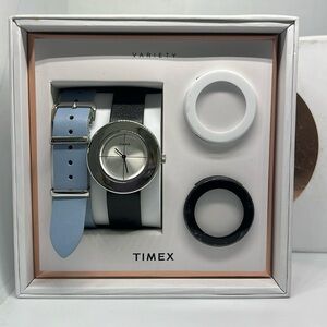 Ladies new Timex watch with an extra strap and two extra bezels.